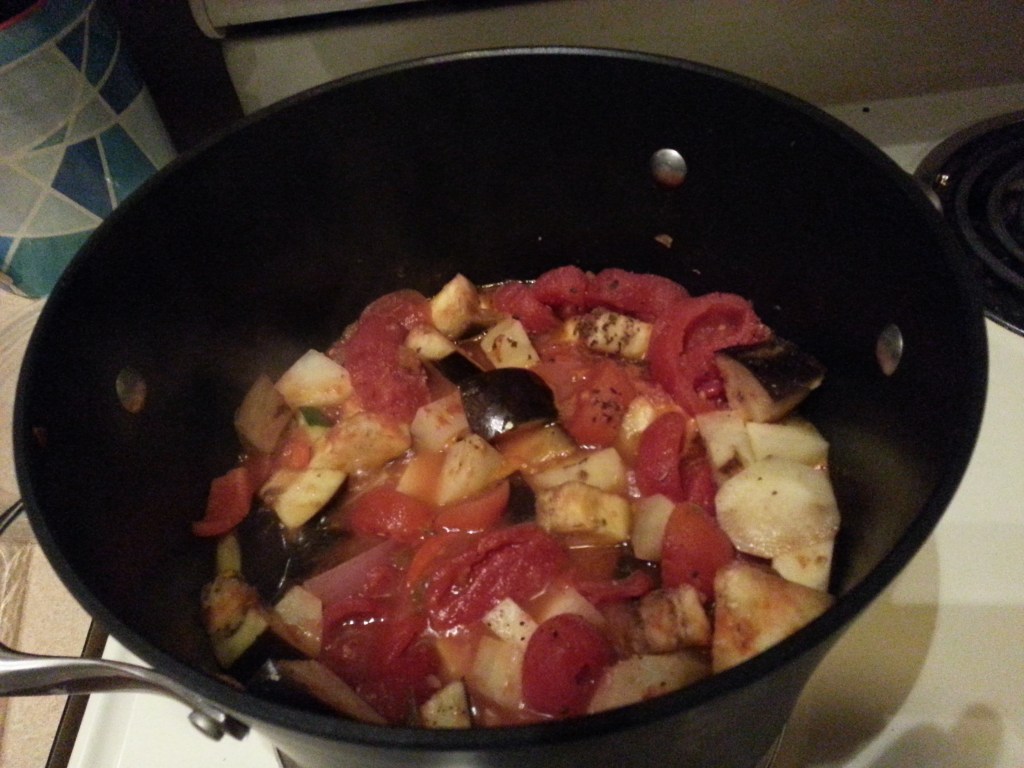 vegetarian eggplant, potato and pepper stew simmering