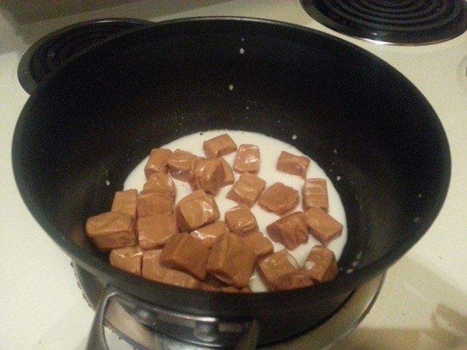heating the caramel with almond milk