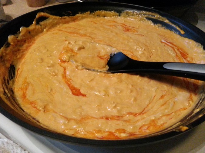 Add half cheddar cheese and cook through.