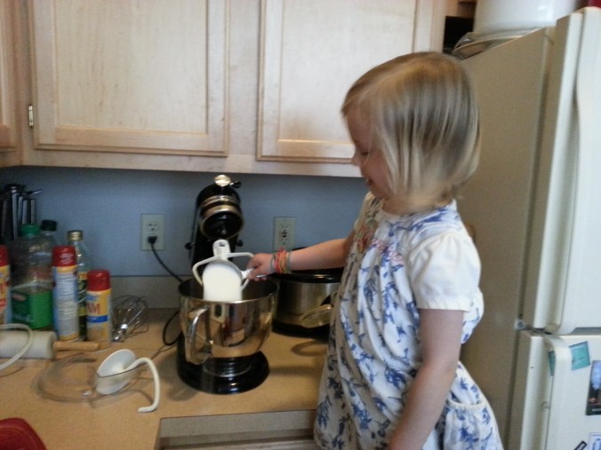 Sofia pours the sugar