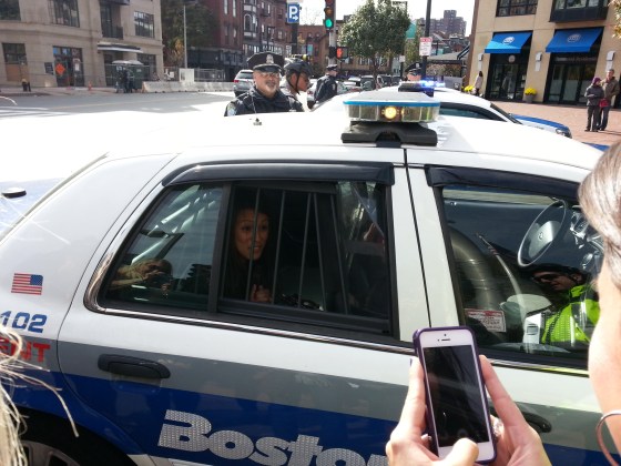 Busted! Melgar in a cop car.