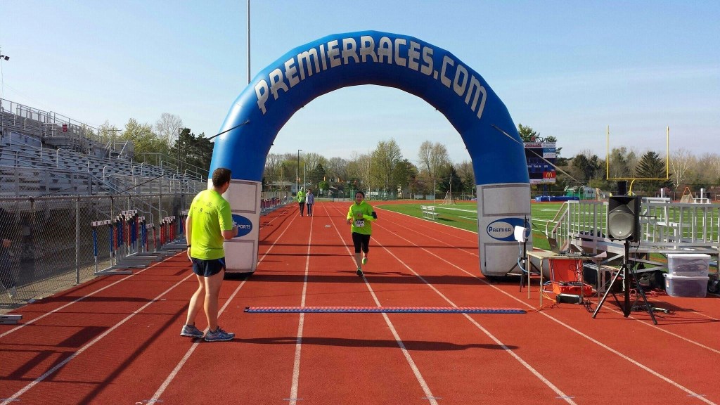 B's aunt took this photo of me crossing the finish - I took First Female!
