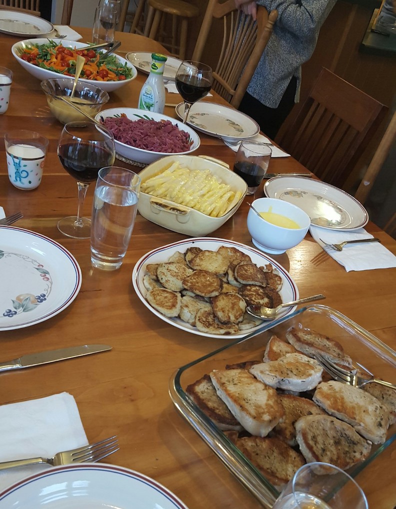 Pork, potato pancakes, asparagus and hollandaise, cabbage and bacon, salad