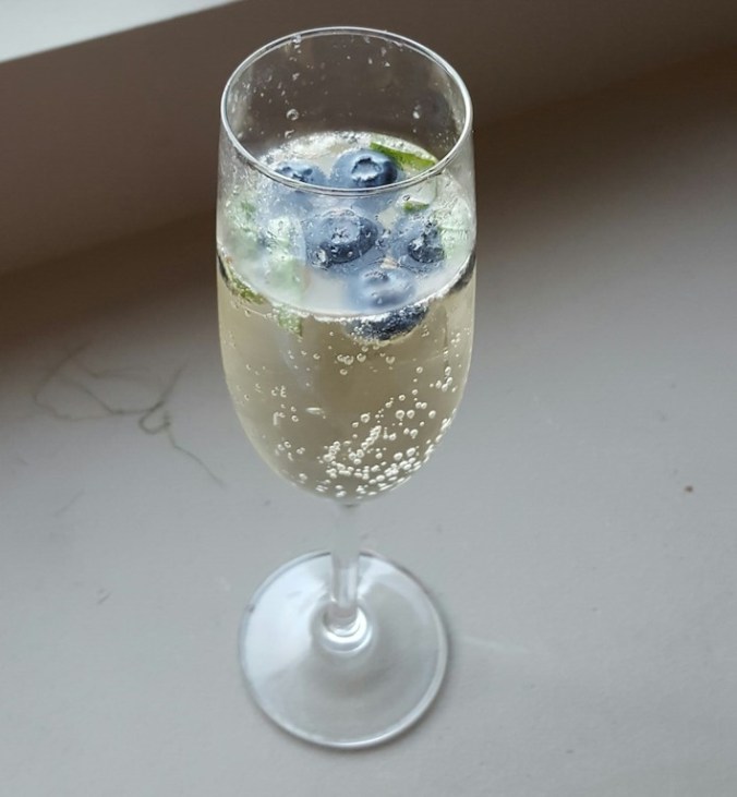 pre-dinner bubbly drink - limoncello, champagne, blueberries and basil