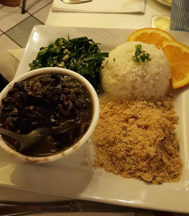 awful picture but amazing food- feijoada and farofa